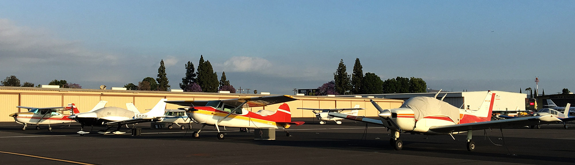 Photo of a row of parked airplanes